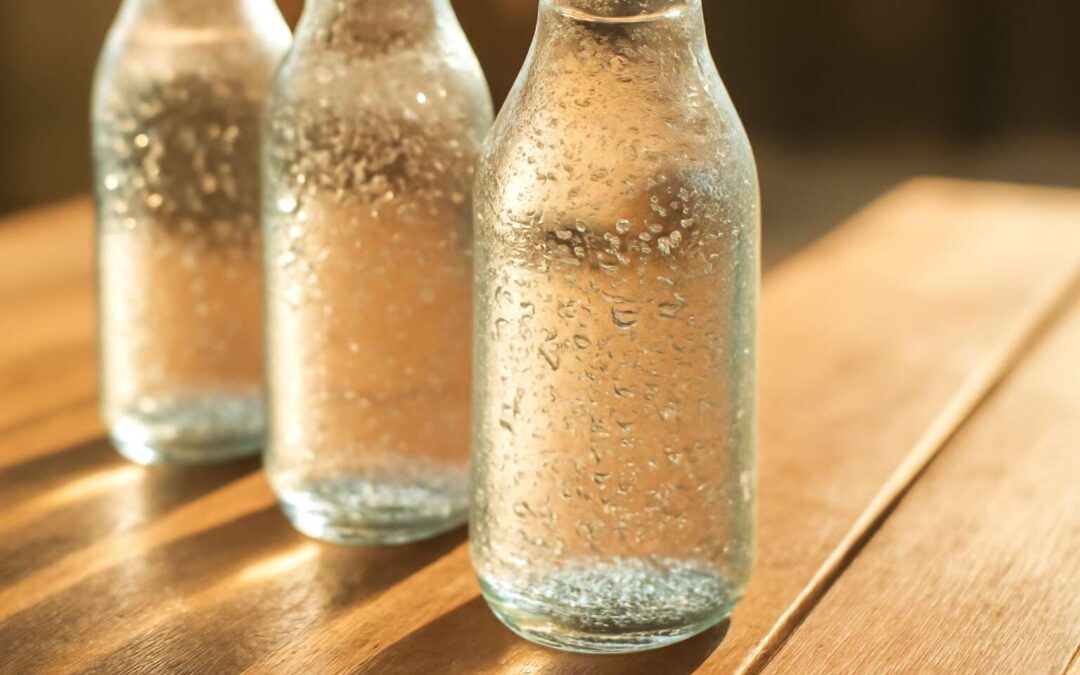 Elevate your sip with glass bottles of sparkling water on every table.